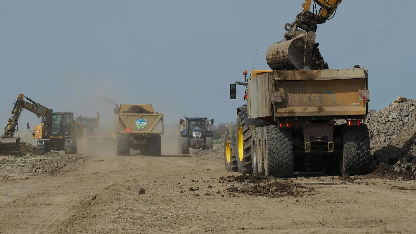 Heavy machinery moving earth at a construction site — excavation work by Hercules Jr. in Duluth, MN